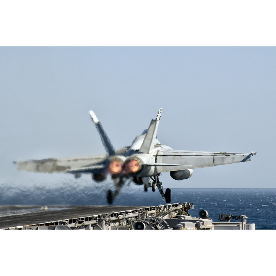 A F/A-18F Super Hornet launches from the flight deck of aircraft carrier USS Nimitz Poster Print Image 1