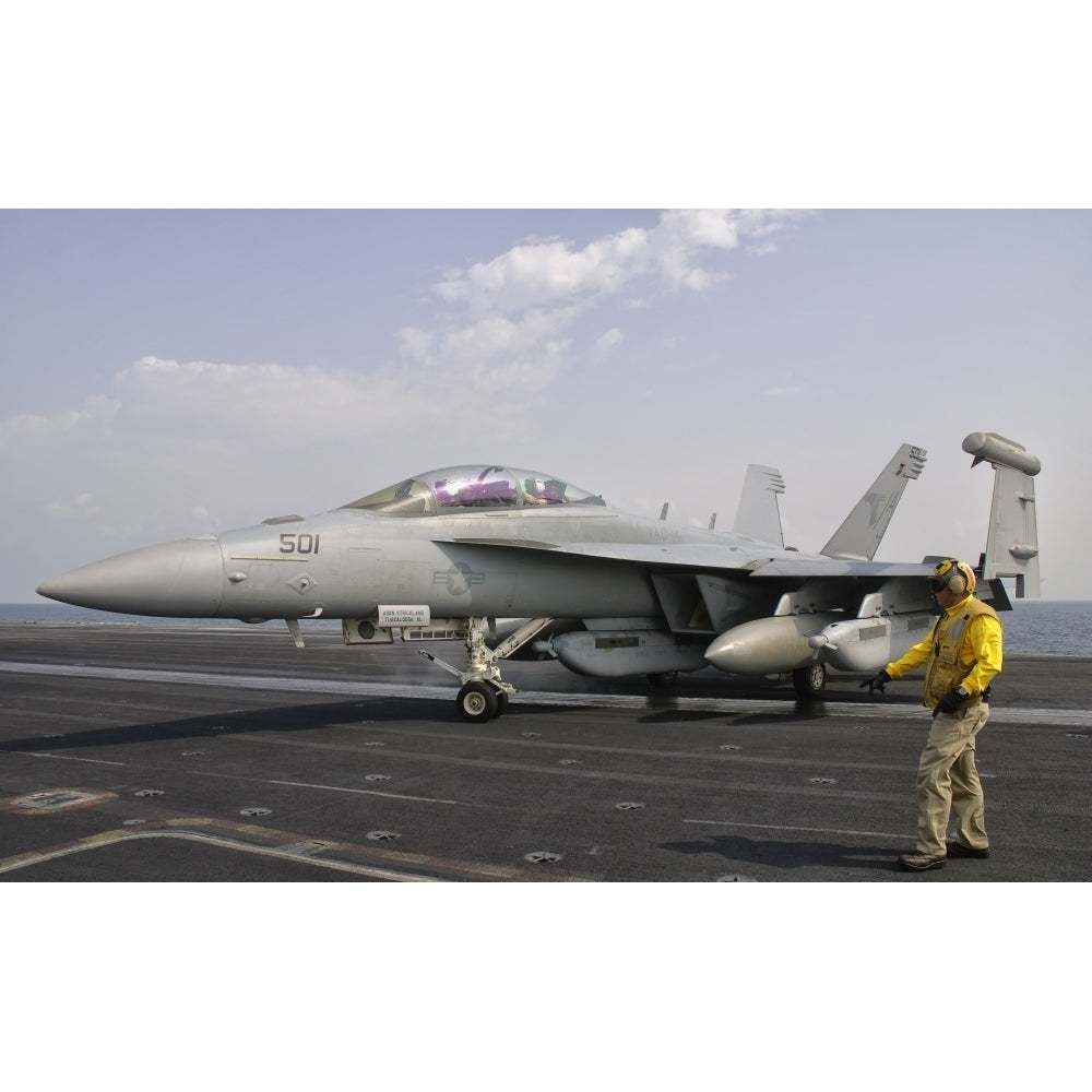 An EA-18G Growler is guided into catapult aboard USS George H.W. Bush Poster Print Image 1