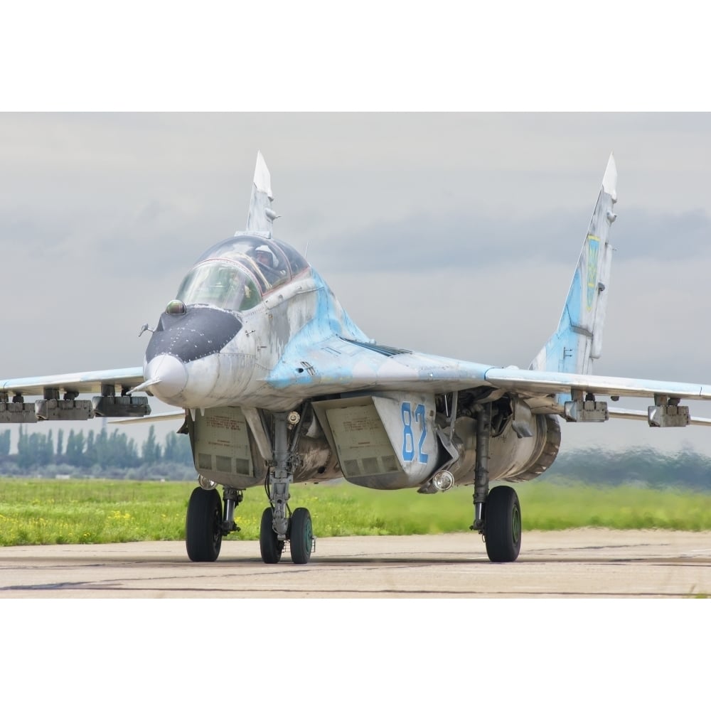 Ukrainian Air Force MiG-29 aircraft taxiing at Mykolaiv Air Base. Poster Print by Giovanni Colla/Stocktrek Images Image 1