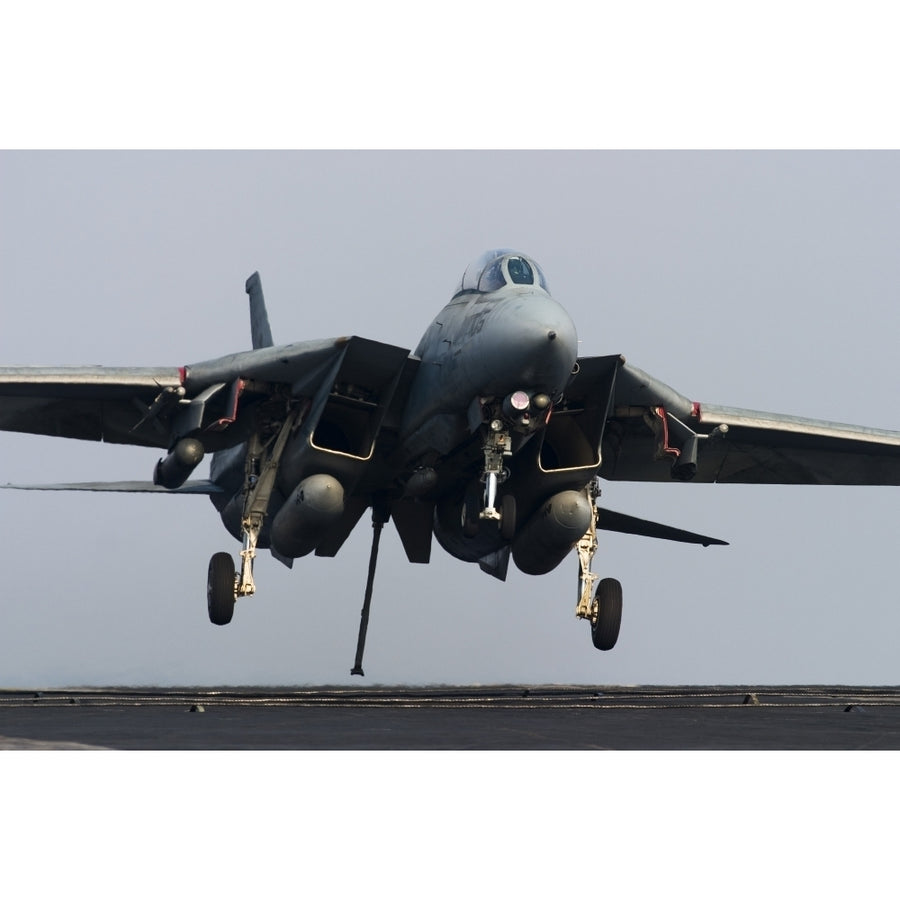 An F-14D Tomcat comes in for an arrested landing on the flight deck of USS Theodore Roosevelt Poster Print Image 1