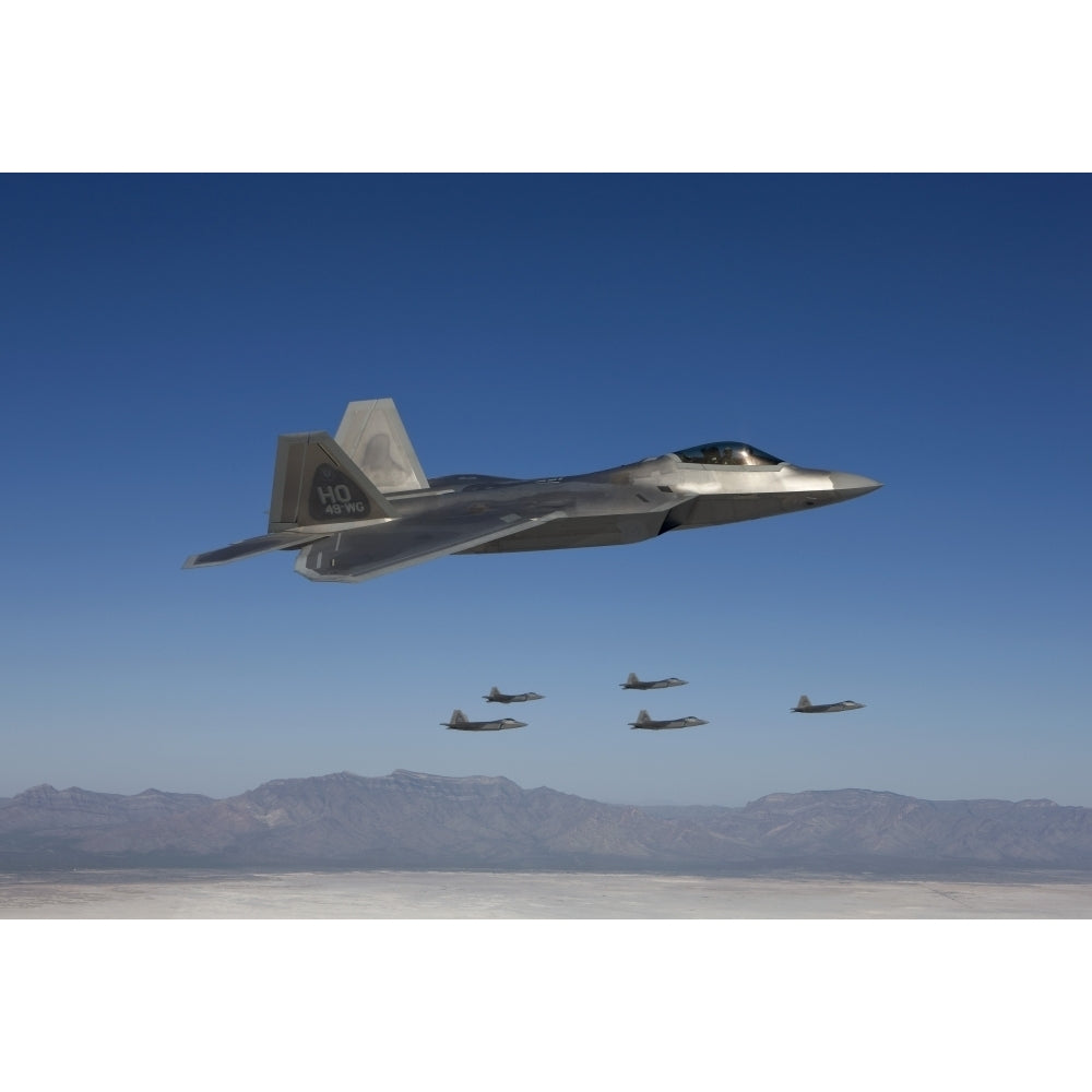 F-22 Raptors fly in formation during a training mission over Mexico Poster Print Image 1