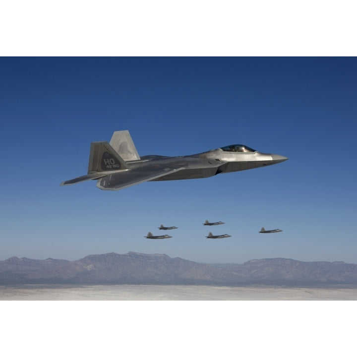 F-22 Raptors fly in formation during a training mission over Mexico Poster Print Image 1