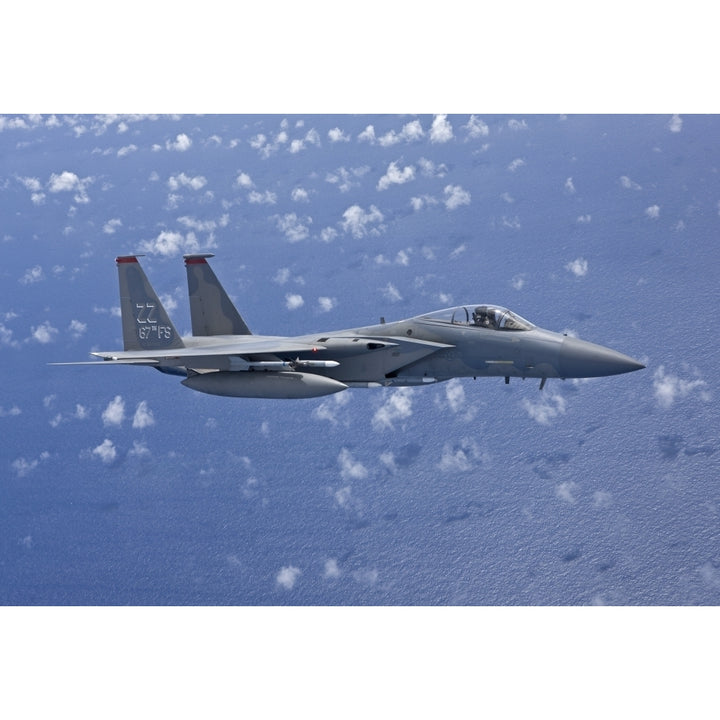 An F-15 Eagle flies over the Pacific Ocean during a training mission Poster Print Image 2