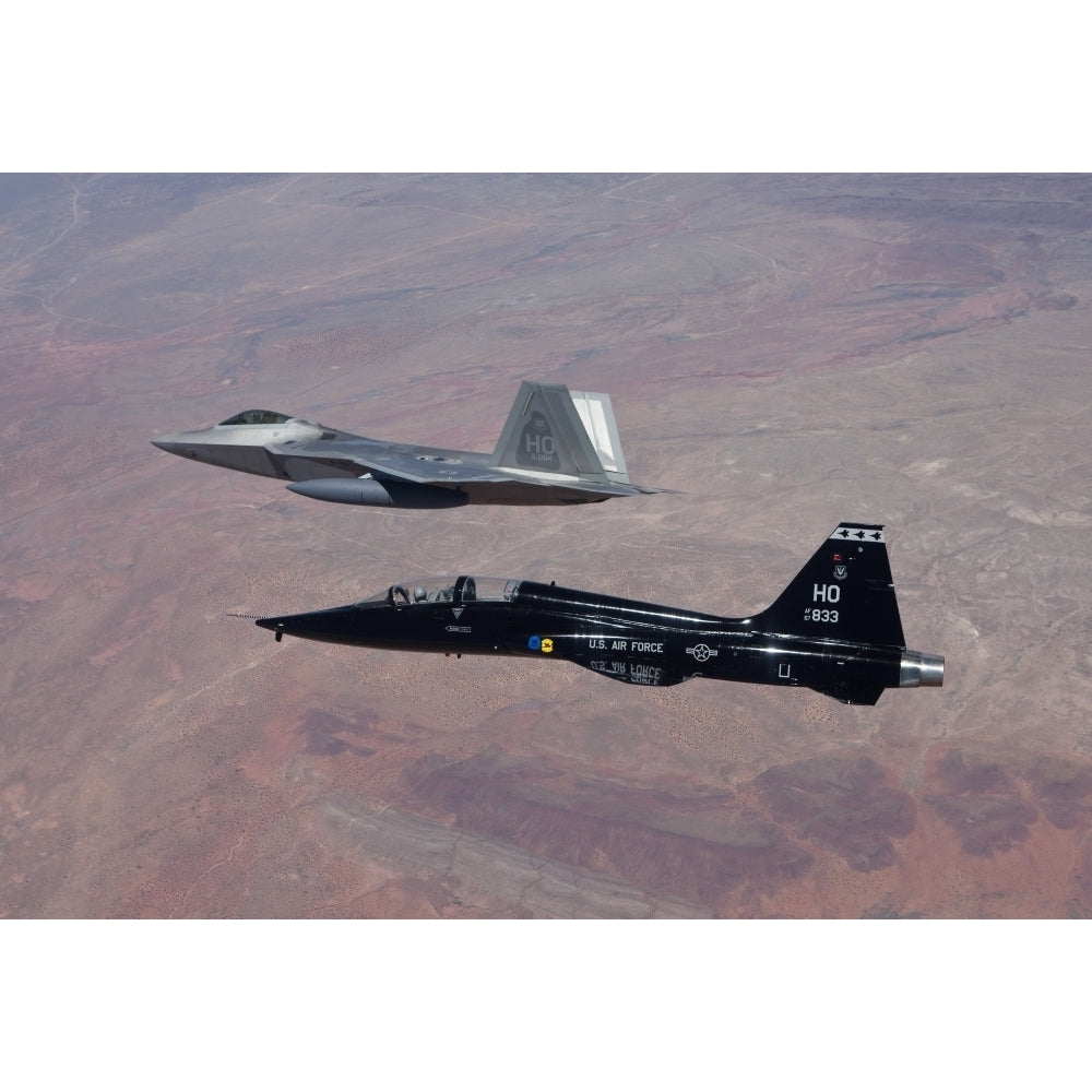 An F-22 Raptor and a T-38 Talon fly in formation over Mexico Poster Print Image 2