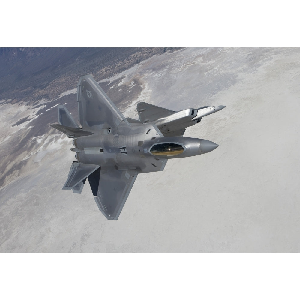 Two F-22 Raptors maneuver while on a training mission over Mexico Poster Print Image 1