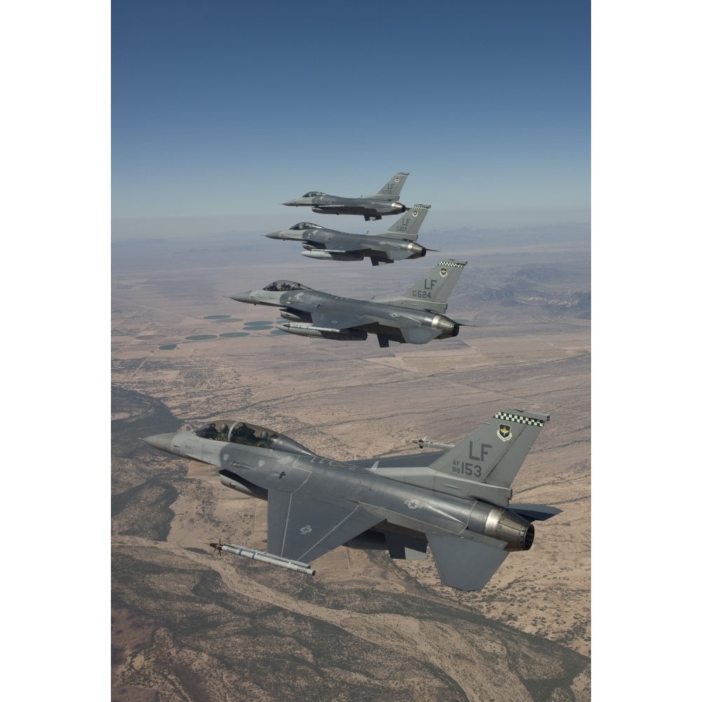 Four F-16s maneuver on a training mission over the Arizona desert Poster Print Image 2