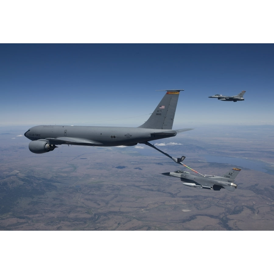 Two F-16 Fighting Falcons conduct aerial refueling with a KC-135 Stratotanker Poster Print Image 1