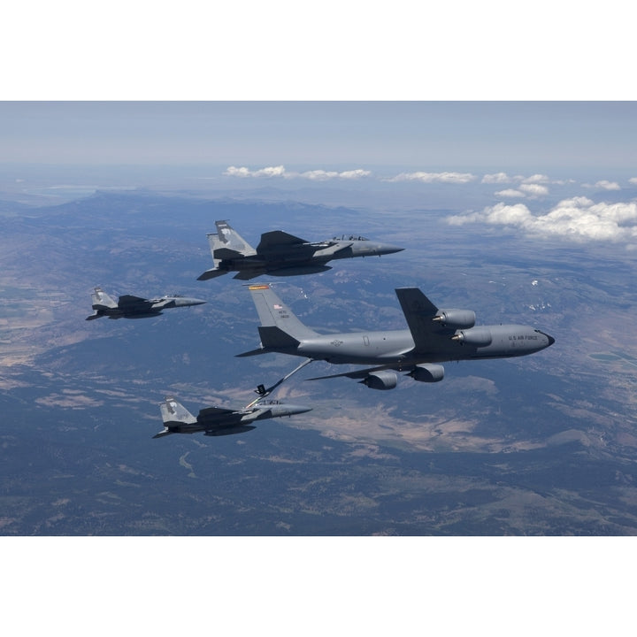 A KC-135R Stratotanker refuels three F-15 Eagles Poster Print Image 1