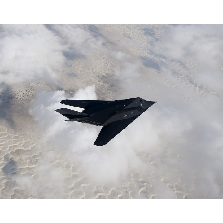 An F-117 Nighthawk stealth fighter in flight over Mexico Poster Print Image 1