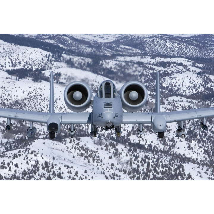 An A-10C Thunderbolt flies over the snowy Idaho countryside Poster Print Image 2