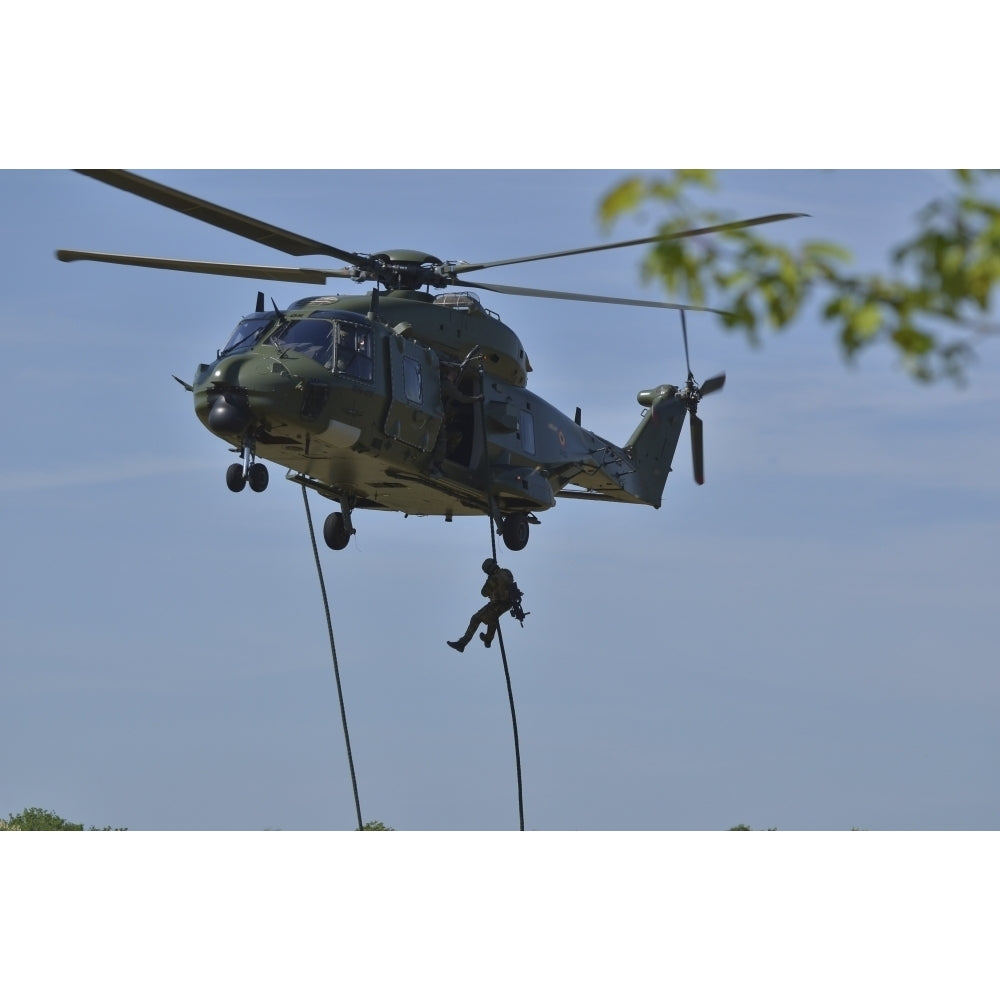 A pathfinder of the Belgian Army fast-roping from a NH90 helicopter Poster Print Image 2