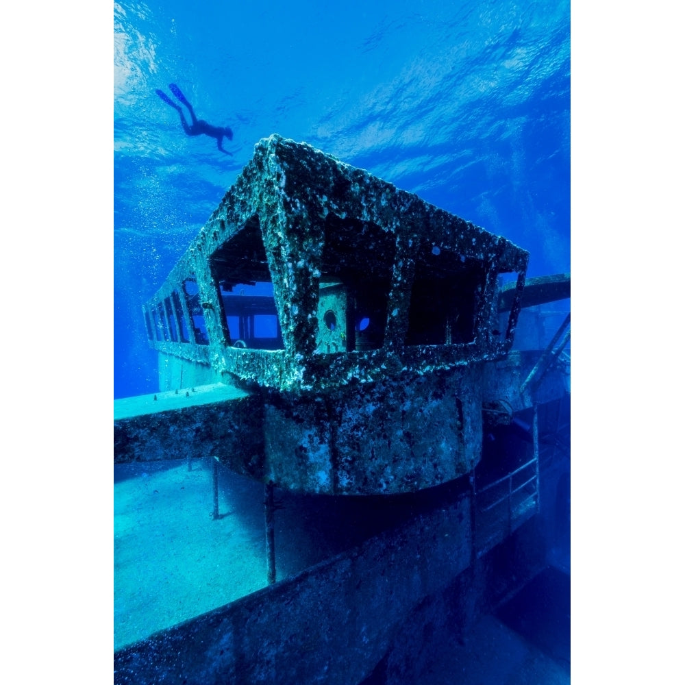 A freediver descends to the USS Kittiwake Grand Cayman Cayman Islands Poster Print by Jennifer Idol/Stocktrek Images Image 2