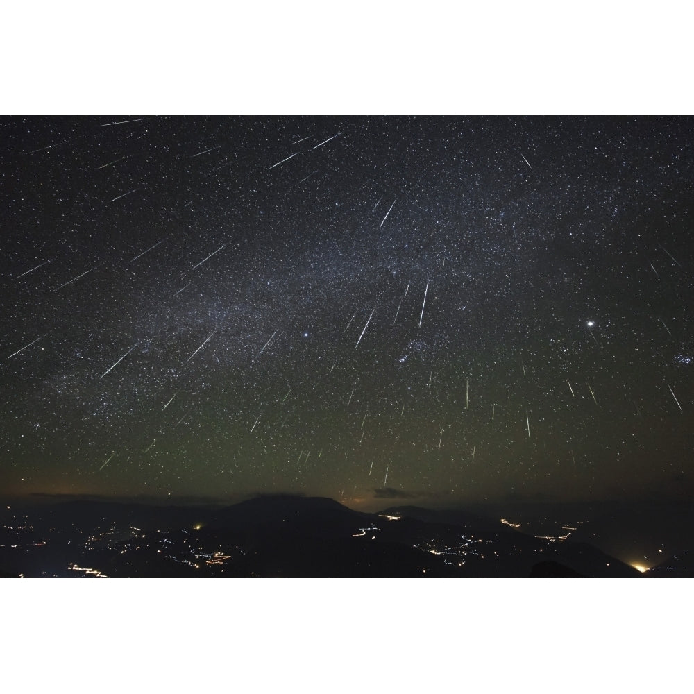 The Geminids meteor shower streaks across the clear sky above Yunnan province of China Poster Print Image 1