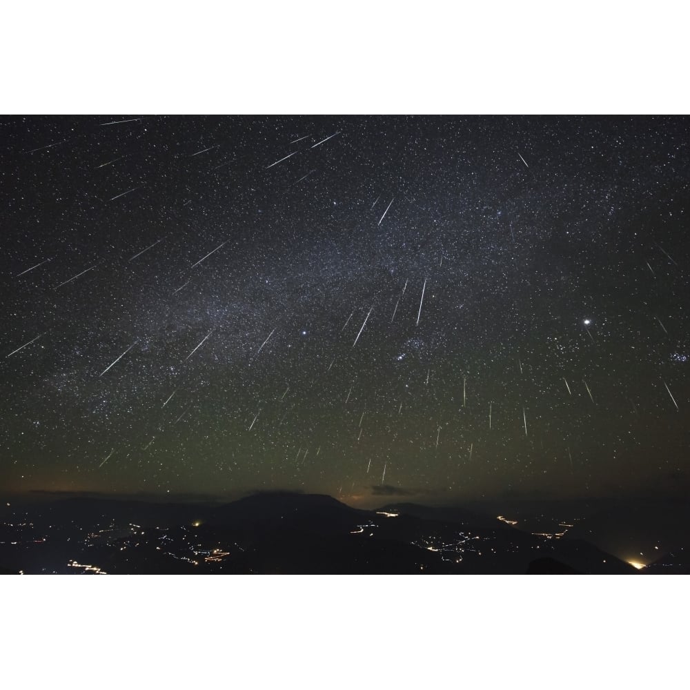 The Geminids meteor shower streaks across the clear sky above Yunnan province of China Poster Print Image 1