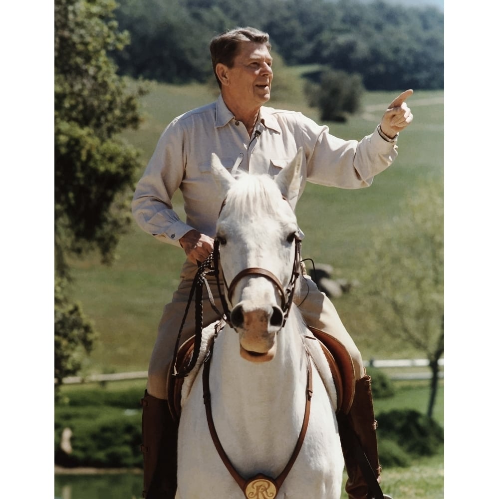 Digitally restored vector photo of President Ronald Reagan on horseback Poster Print Image 1