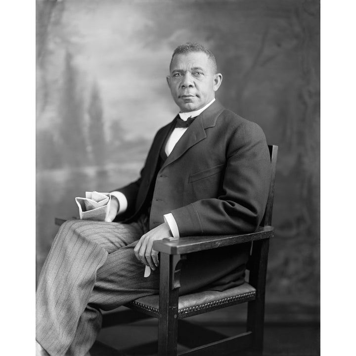 Portrait of Booker T. Washington sitting in a chair Poster Print Image 1