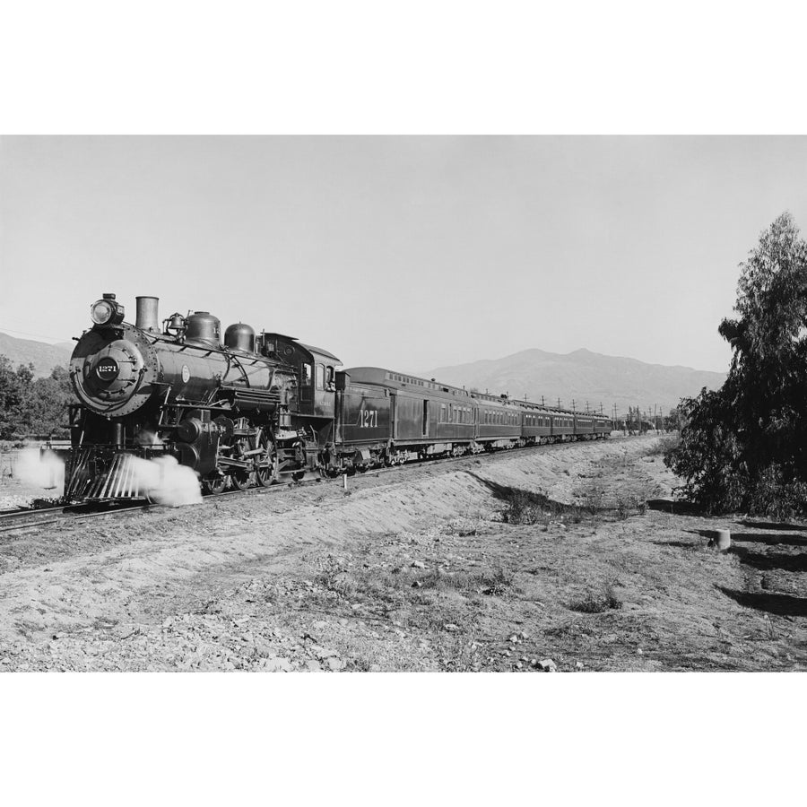 Vintage photo of a passenger train speeding down the tracks Poster Print by John Parrot/Stocktrek Images Image 1