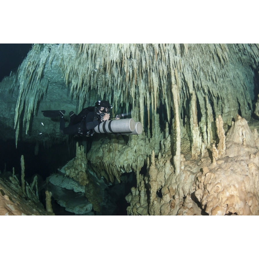 Diver using side mount gear in cave in Mexico Poster Print Image 1