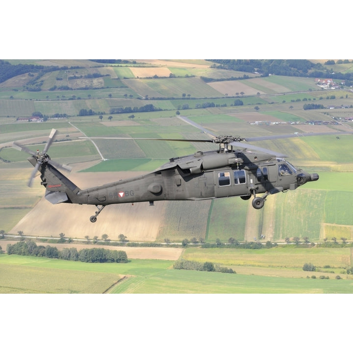 UH-60 Black Hawk helicopter of the Austrian Air Force in flight Poster Print Image 1