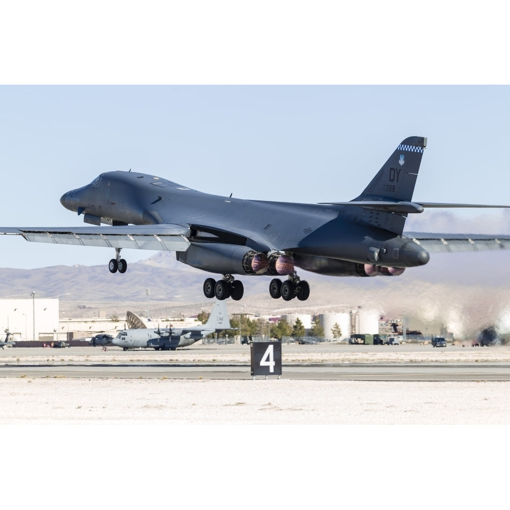 A B-1B Lancer of the U.S. Air Force takes off from Nellis Air Force Base Nevada. Poster Print by Rob Edgcumbe/Stocktrek Image 2