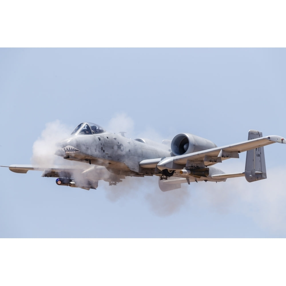 A U.S. Air Force A-10 Thunderbolt II fires its 30mm gun at a strafe target. Poster Print by Rob Edgcumbe/Stocktrek Image Image 1