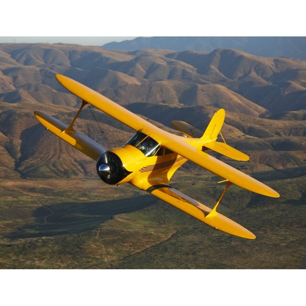 A Beechcraft Model B17R Staggerwing in flight Poster Print Image 1