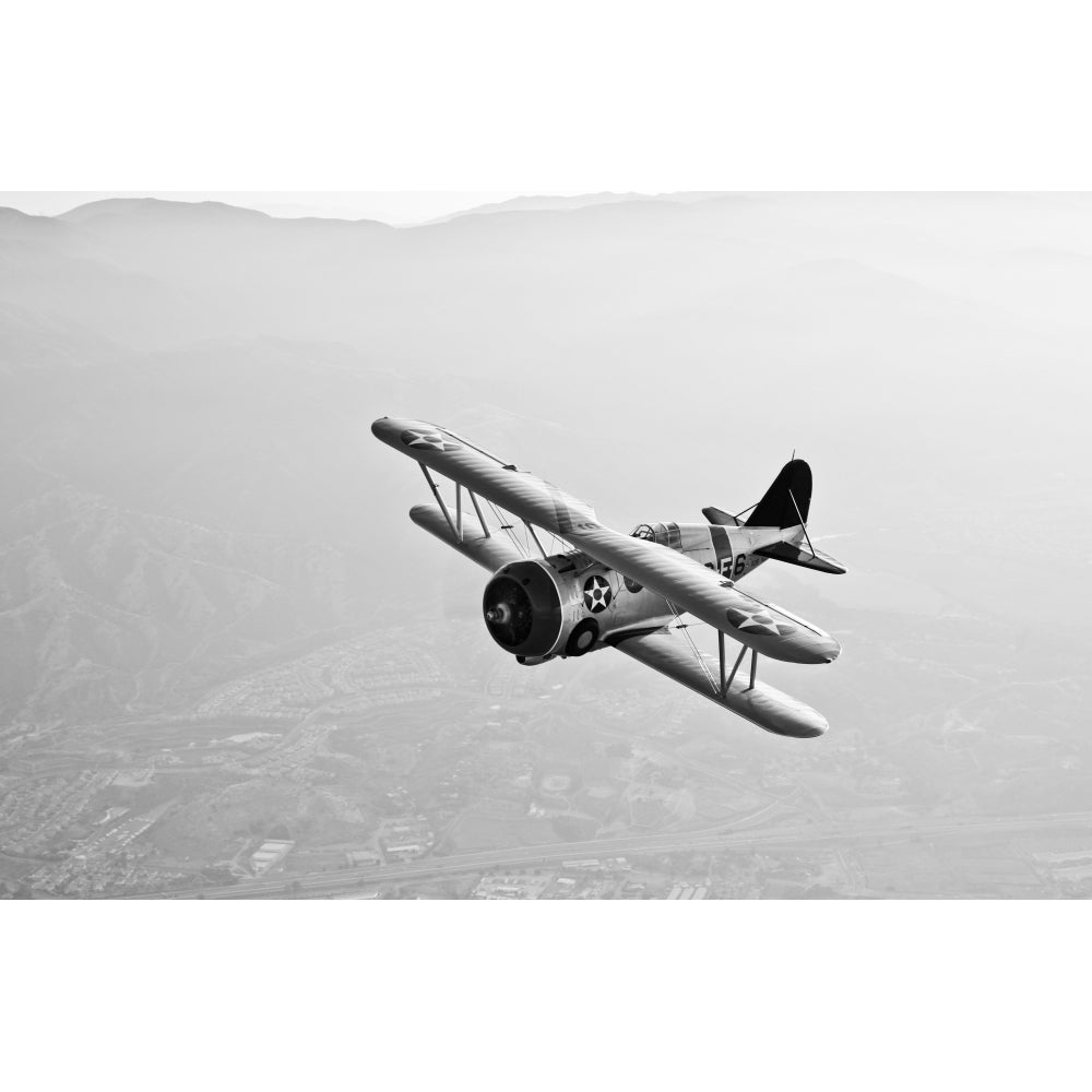 A Grumman F3F biplane in flight Poster Print Image 1