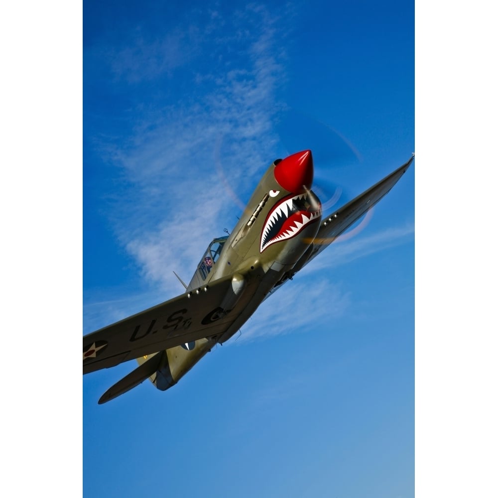 A Curtiss P-40E Warhawk in flight near Chino California Poster Print Image 1