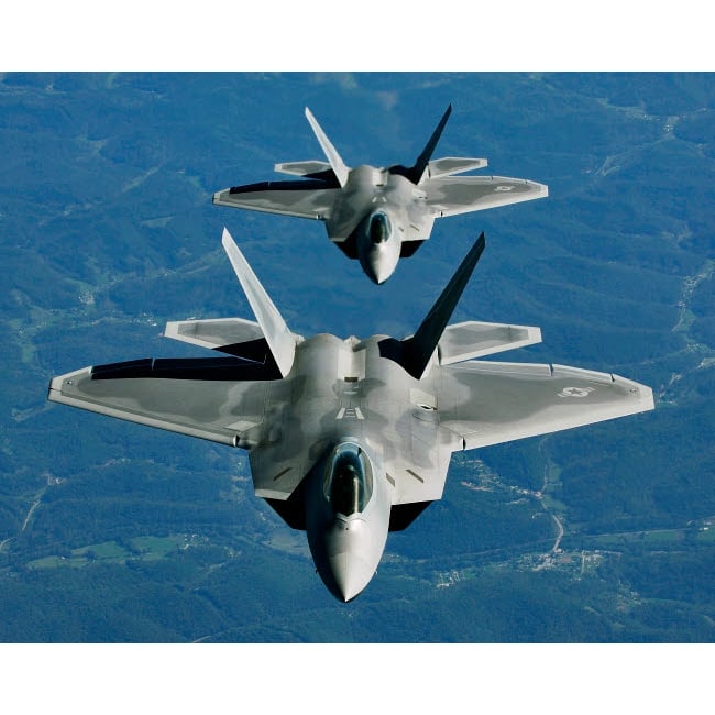 Two F-15s fly in formation behind a KC-10 Extender Poster Print by Stocktrek Images Image 1