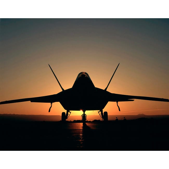 Silhouette of a F-22 Raptor Poster Print by Stocktrek Images Image 1