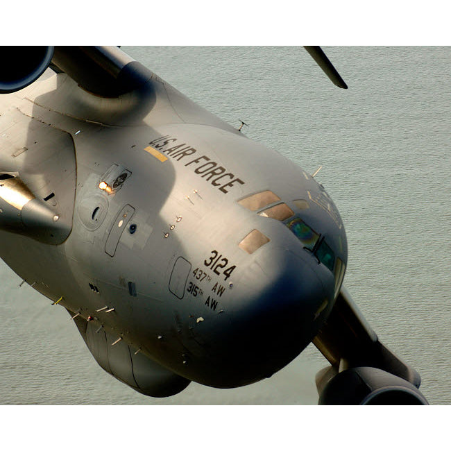 A C-17 Globemaster III banks over the Atlantic Ocean Poster Print by Stocktrek Images Image 1