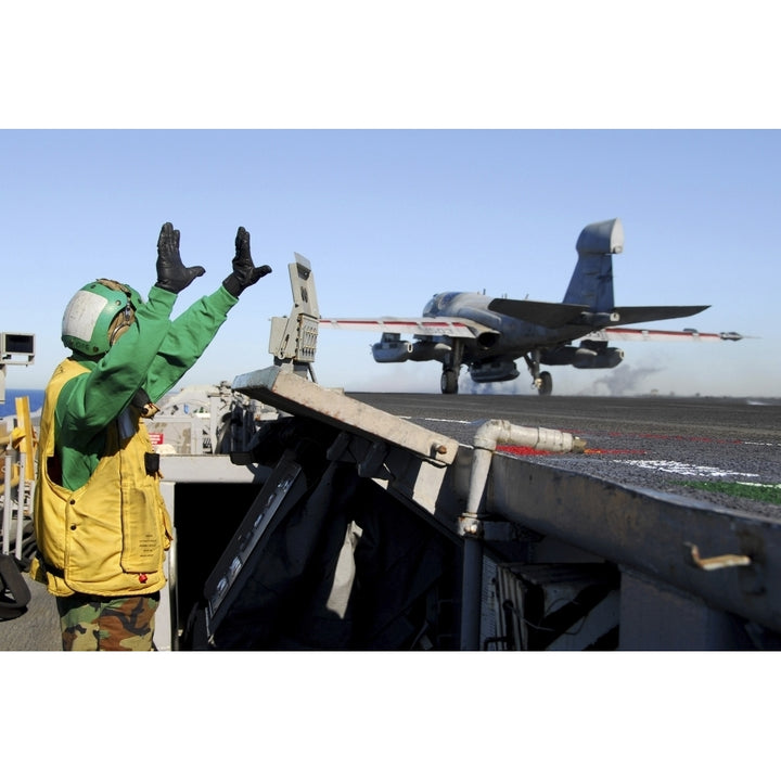 An EA-6B Prowler launches from the flight deck aboard USS Nimitz Poster Print Image 2