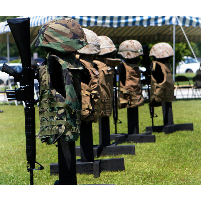 Memorials of flak jackets and protective helmets Poster Print by Stocktrek Images Image 1