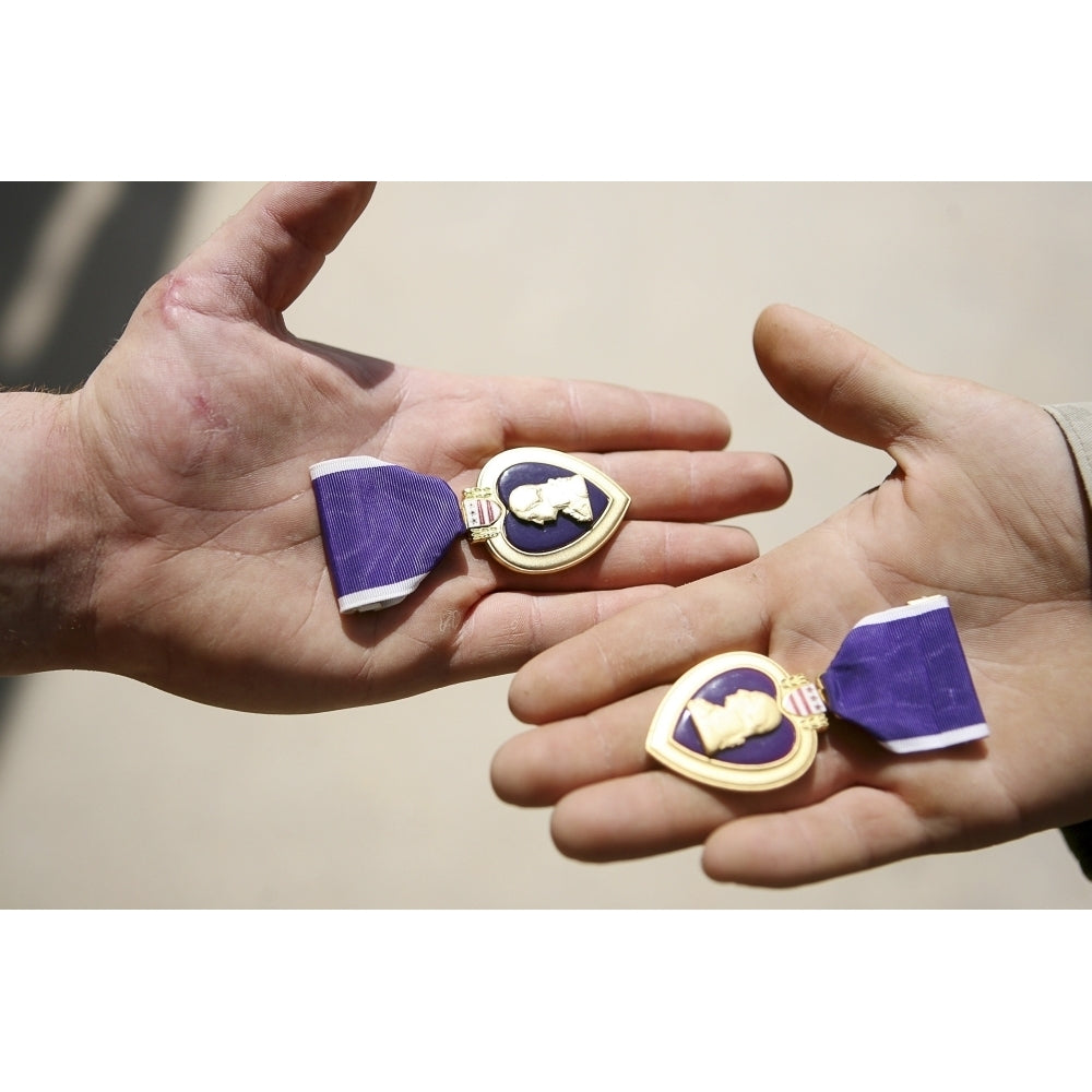 Purple Heart recipients display their medals in their hands Poster Print Image 1