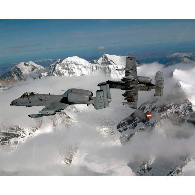 A-10 Thunderbolt IIs fly over mountainous landscape Poster Print by Stocktrek Images Image 1