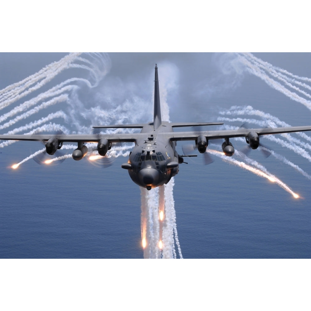 An AC-130H gunship aircraft jettisons flares as an infrared countermeasure Poster Print Image 2