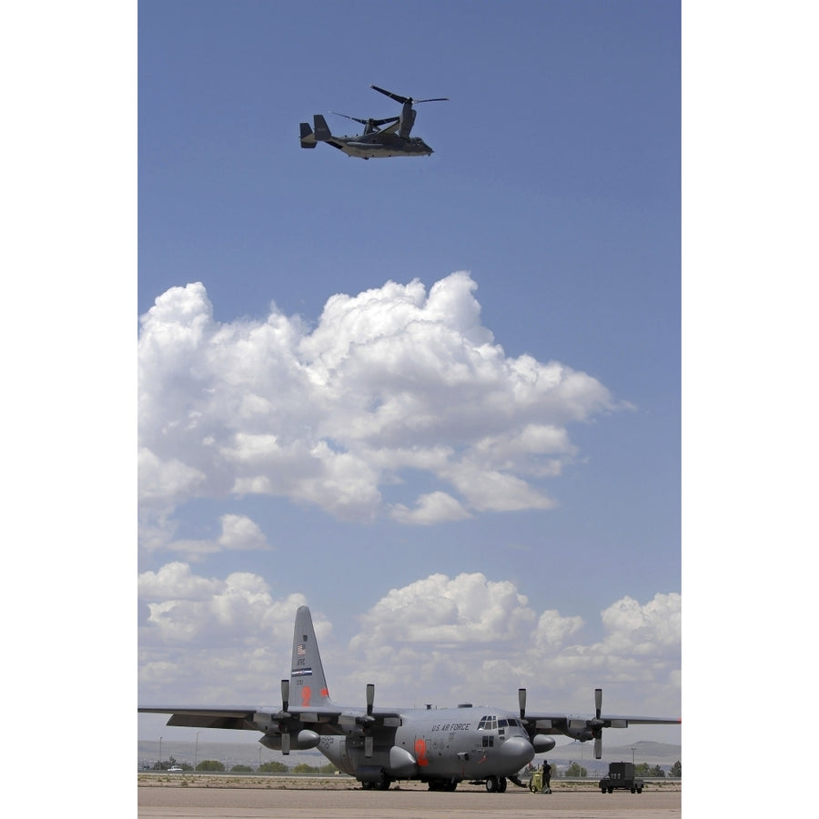 A CV-22 Osprey flies over a C-130 Hercules Poster Print Image 1