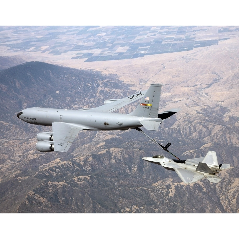 An F-22 Raptor receives fuel from a KC-135 Stratotanker Poster Print Image 1