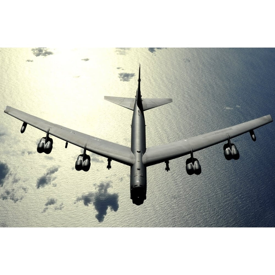 A B-52 Stratofortress in flight over the Pacific Ocean Poster Print Image 1