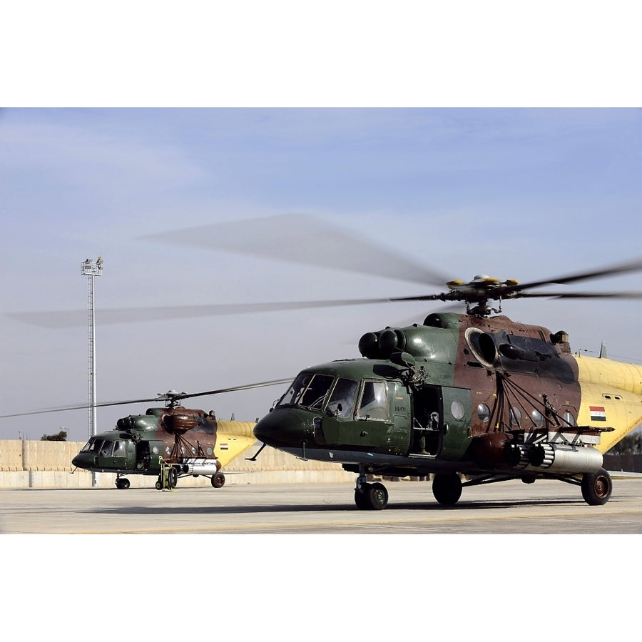 Two Iraqi Mi-17 Hip Helicopters conduct an aeromedical evacuation mission Poster Print Image 1