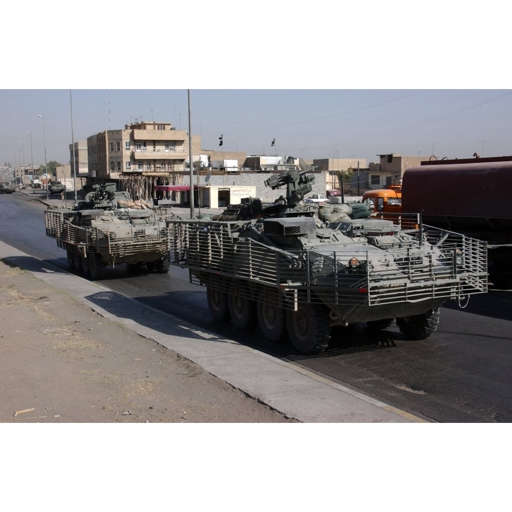 U.S. Army soldiers patrolling in Stryker armored wheeled vehicles as part of Operation Block Party Print Image 1