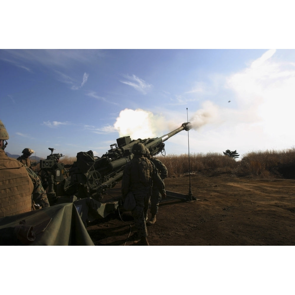 Artillerymen fire a 155mm round out of an M777 lightweight howitzer Poster Print Image 1