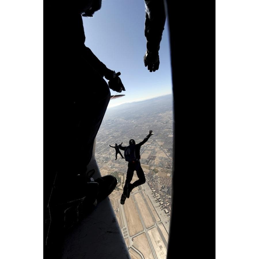 U.S. Air Force Academy Parachute Team jumps out of an aircraft over Nellis Air Force Base Nevada Poster Print Image 1