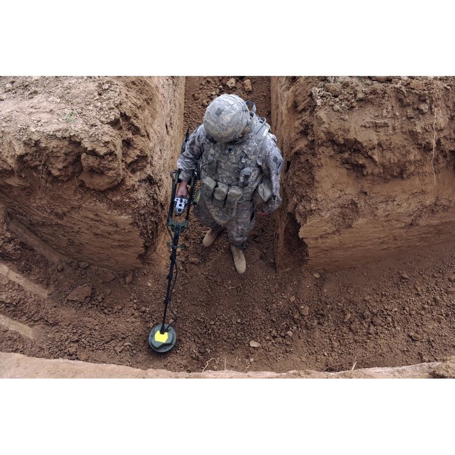 U.S. Army Specialist searches for a weapons cache in Kirkuk Iraq Poster Print Image 1