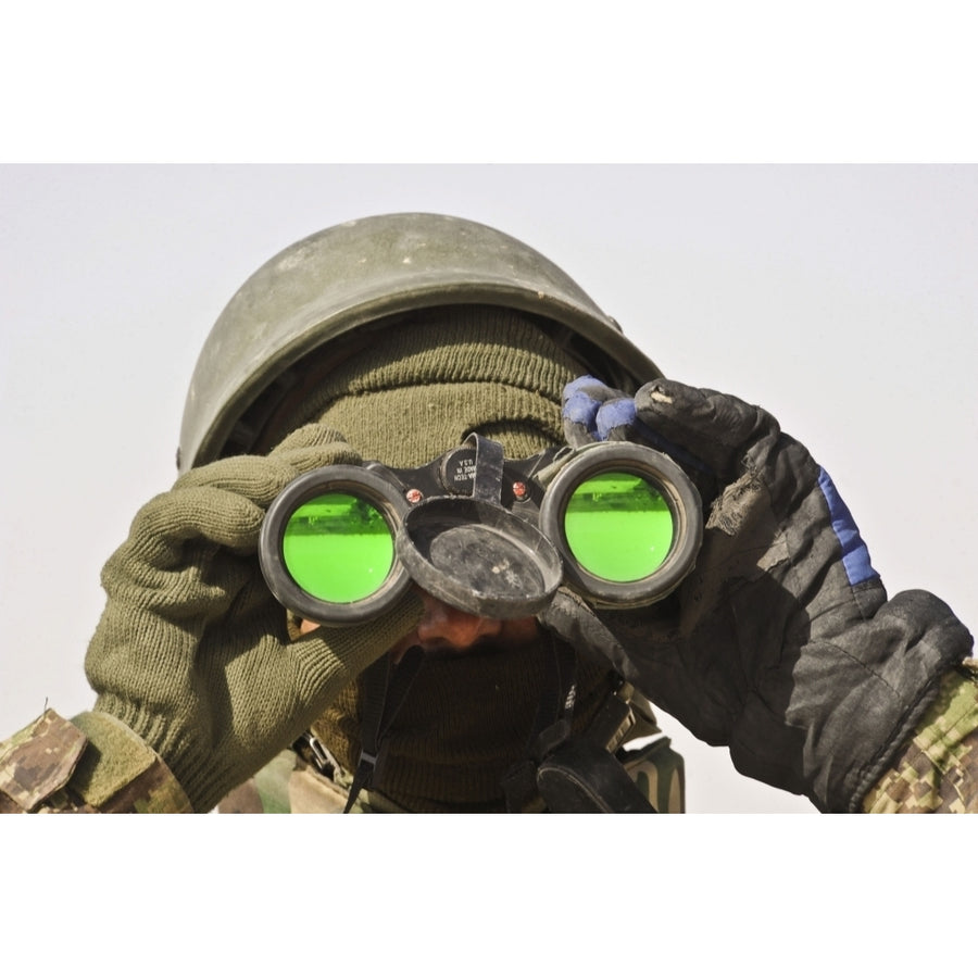 An Afghan soldier scans the horizon for enemy movements Poster Print Image 1