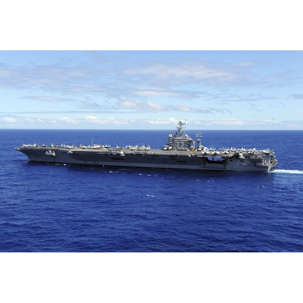 The aircraft carrier USS Abraham Lincoln transits across the Pacific Ocean Poster Print Image 1