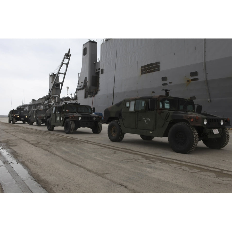 Humvees depart USS Harpers Ferry in support of Operation Tomodachi Poster Print Image 1