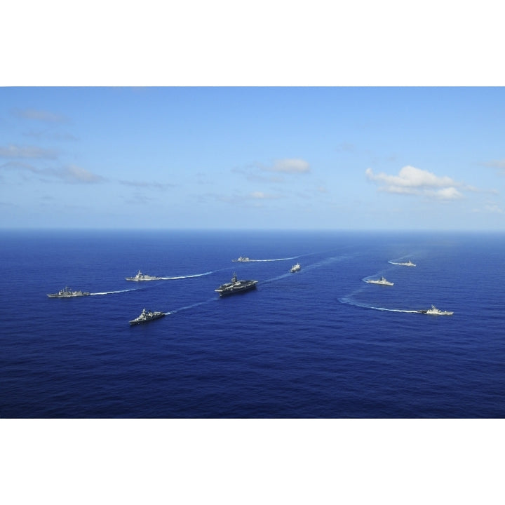 Ships from the Ronald Reagan Carrier Strike Group transit the Pacific Ocean Poster Print Image 1