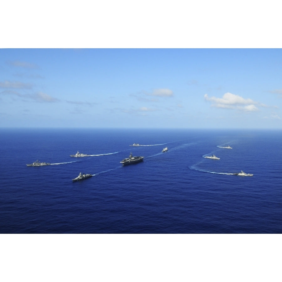 Ships from the Ronald Reagan Carrier Strike Group transit the Pacific Ocean Poster Print Image 1