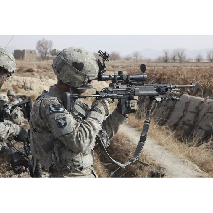 A U.S. Army soldier looks through the scope of his M-14 sniper rifle Poster Print Image 2